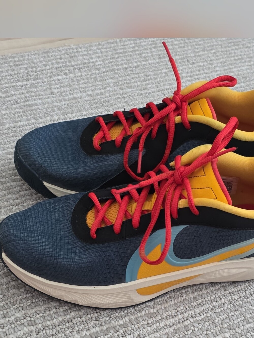 Nike Navy Sneakers with Red Laces & Yellow Accents